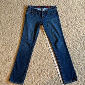 X2 skinny jeans with gold color stitching. Size 6L